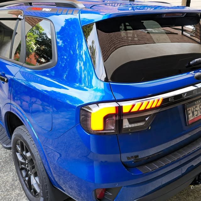 Coated vehicle with deep gloss finish